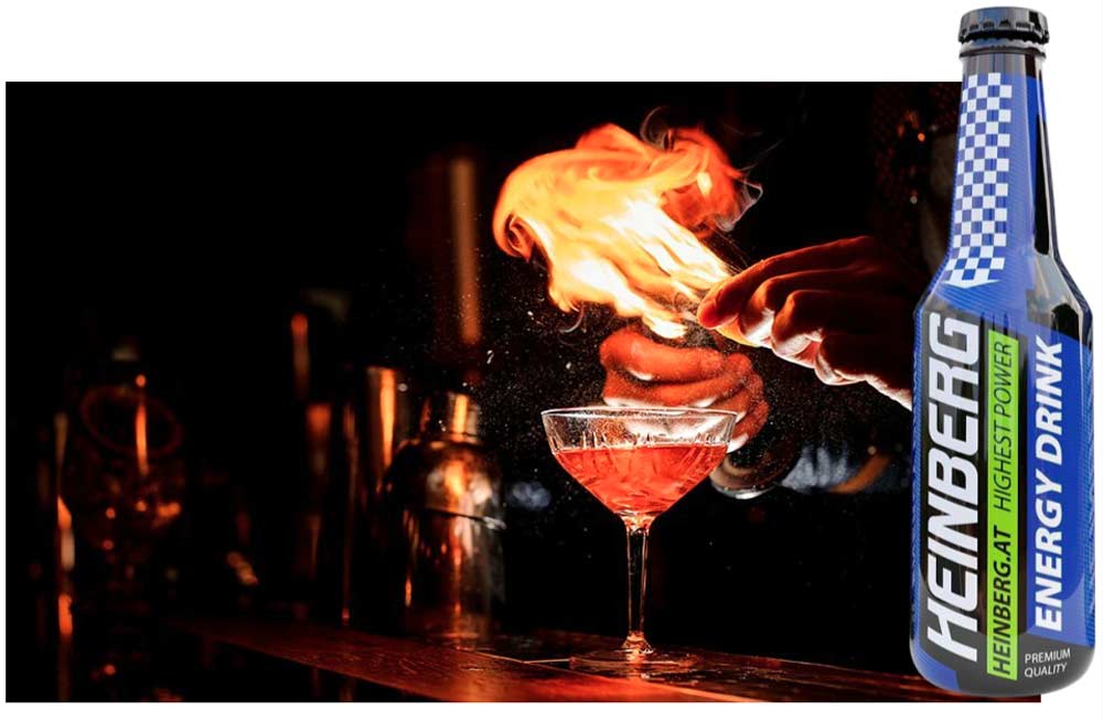 ترکیبات و مصرف نوشابه انرژی زا هاینبرگ- مردی مقداری از آن را داخل گیلاس ریخته و شعله آتش به نشانه انرژی زا بودن دیده می شود